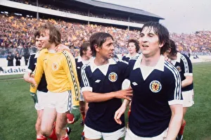 Scotland footballers Tom Forsyth and goalkeeper Alan Rough celebrate victory over England