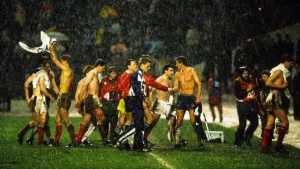 Flooding Prints: Scotland players leave pitch in heavy rain following their World Cup qualifier against