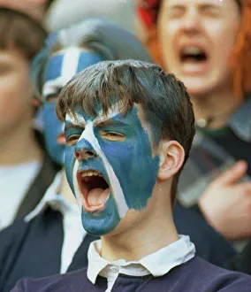 Scotland supporter shouts encouragement to rugby team during international against