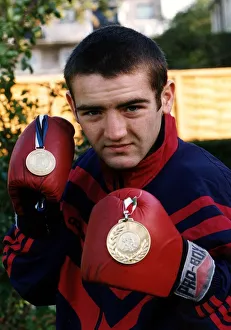 Scott Harrison Scottish European boxing Champion holding two medals