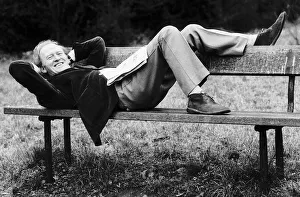 Occupation A Prints: Scottish actor Gordon Jackson relaxing on park bench 1975 on Hampstead Heath