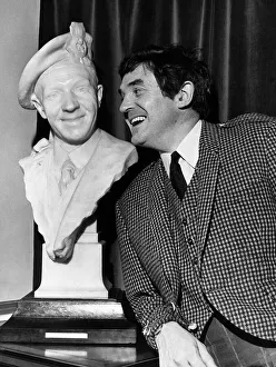 Castle Prints: Scottish comedian Jimmy Logan inside Culzean castle standing next to a bust of Sir Harry
