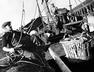 Scottish fisherman of 50 years Alec Gardiner gives a hand on the drifter