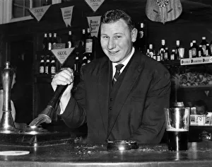 Former Scottish international goalkeeper Tommy Younger keeps fit pulling pints in his