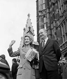 Scottish Nationalist MP Winnie Ewing waves as she stands outside the House of Commons