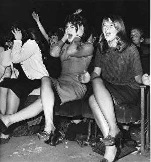 Screaming girl fans greet the Beatles on their appearance at the ABC Cinema in Edinburgh
