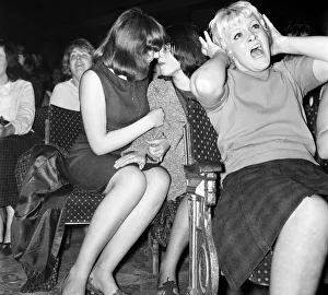 Screaming girl fans greet the Beatles on their appearance at the ABC Cinema in Wigan