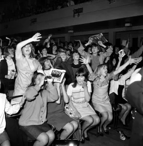 Screaming girl fans greet the Beatles last night on their appearance in Leicester