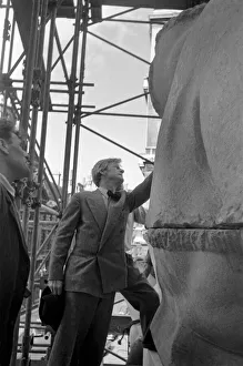 Sculptor Chas Wheeler overseeing the installation of his work Miss Earth