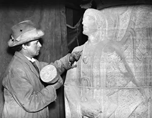A sculptor working on a sculpture of an angel for the Anglican Cathedral in Liverpool