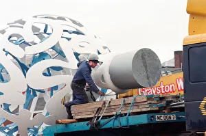00834 Prints: The sculpture Bottle of Notes is lifted off its low loader in the Central