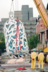 00834 Prints: The sculpture Bottle of Notes is lifted off its low loader in the Central