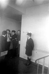 SDLP politician John Hume MP, being searched inside the county hall by police