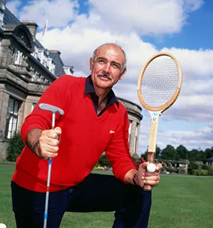 Sean Connery holding tennis raquet and golf club August 1981