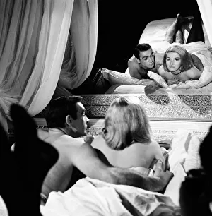 Screen Prints: Sean Connery as James Bond with actress Daniela Bianchi as Tatiana Romanova in scene