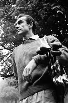 01343 Collection: Sean Connery playing golf near new house in Acton. The house was once a Convent