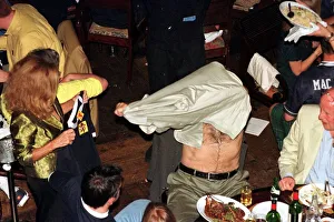 Sean Connery takes off shirt June 1998 and puts on Scottish top given to him by his wife