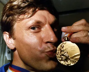 Medal Prints: Sean Kerly kisses his 1988 Olympic gold medal at Heathrow