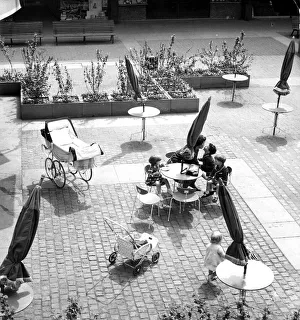 Seating ouside the circular Godiva Cafe in the Lower Precinct