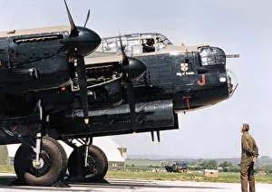 Plane Prints: A Second World War Avro Lancaster bomber pictured leaving RAF St Athan after a refit