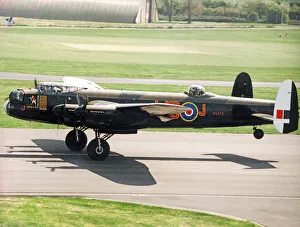 A Second World War Avro Lancaster bomber pictured leaving RAF St Athan after a refit
