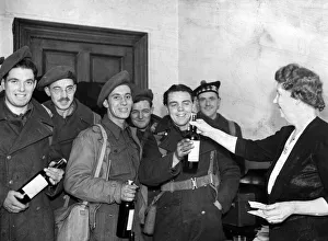 Second World War January 1945 Servicemen on leave receive bottle of whisky