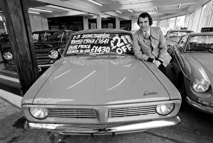 Secondhand car salesman Mr. John Leek of Birmingham All Electric Garage seen here with