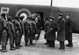 01465 Prints: At a secret RAF station in Britain, paratroopers enter an aircraft under the watchful