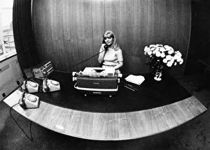 How a secretary adds up: There she sits, a lovely creature surrounded by all