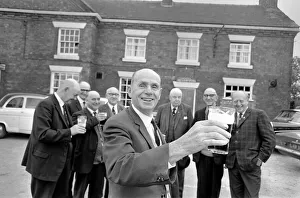 00034 Prints: Secretary of the Bald Head d Mens Club Vic Hinds with some of his members outside