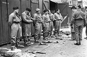 Secretary of State for War Mr Oliver Stanley inspects the gas protective clothing during