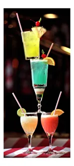 A selection of cocktails stacked into a tower on the bar September 1998 p