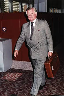 Briefcase Prints: Senator Edward Kennedy pictured arriving at London Heathrow Airport July 1989