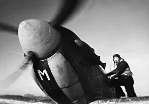 Pilot Prints: Sergeant S. W. Loader of New Barnet climbs into his Spitfire to join a Channel sweep