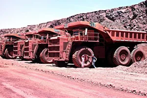Dramatic Prints: Series of large haul packs iron ore mine at Mount Newman in Western Australia