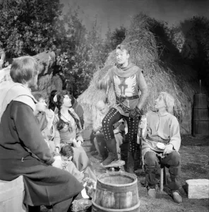 On set with the cast of the television series The Adventures of Sir Lancelot