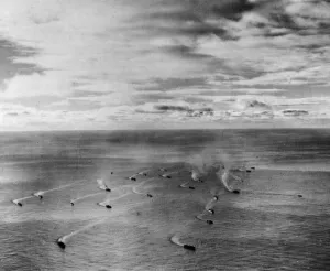 Escort Prints: A setting sun dapples the clouds and streaks the waters of the Atlantic Ocean as one more