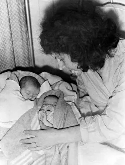 Babies Prints: Seven week old twins Carol and Edna Bunn with their mother after being bombed out of home