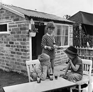 Serving Prints: Seven-year-old Karen Thompson licensee'of the pub where time is never called