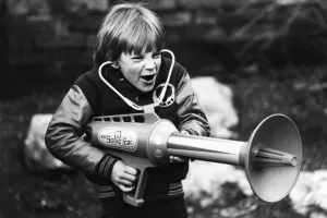 00264 Prints: Seven year old Matthew Allen tries out his new sonic laser gun. 29th January 1979