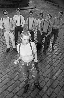 Seventeen year old skinhead teenager Janet Askham poses with her friends at her home in