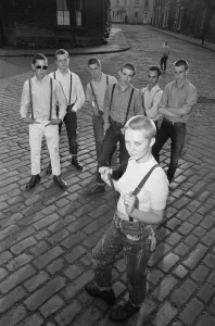 Seventeen year old skinhead teenager Janet Askham poses in the street at her home in