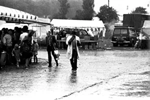 Stalls Prints: Severe stormy weather with torrential rain and flooding at the annual Summer Exhibition