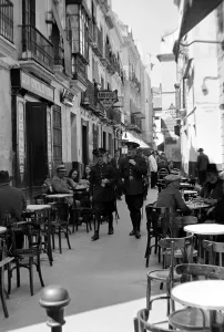 00169 Prints: Seville Spain - Street Scene Police Patrol cafes circa 1955