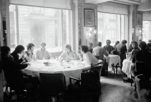 Eating Out Prints: The Sex Pistols punk rock band seen here in the Langans Restaurant in London