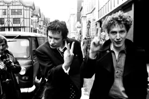 Sex Pistols singer Johnny Rotten leaving Malborough Street Court with Malcolm McLaren