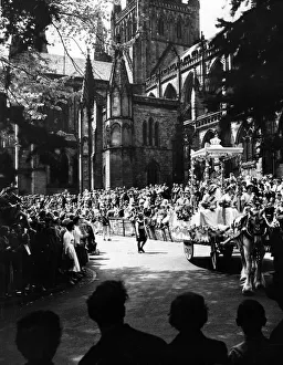 In the shadow of Lichfield Cathedral, the Greenhill Bower procession makes its way