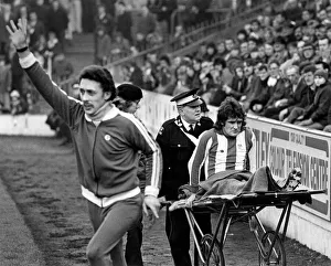 Physio Prints: Sheffield Wednesdays Colin Harvey is wheeled off in pain
