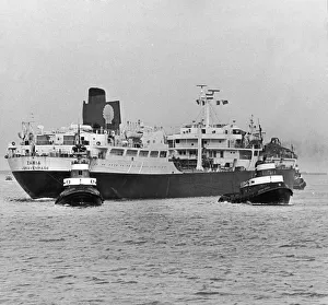 Tugs Prints: The Shell tanker Zaria seen here being given a helping hand into the River Tees by tugs