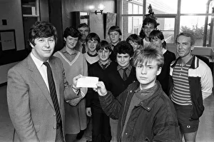 Shelley High School and Sixth form pupils present cheque of 115 to Graeme Staniforth of